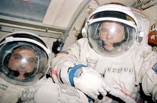 Mir-24 Commander Anatoly Solovyev and Mission Specialist David Wolf wearing their Sokol suits.